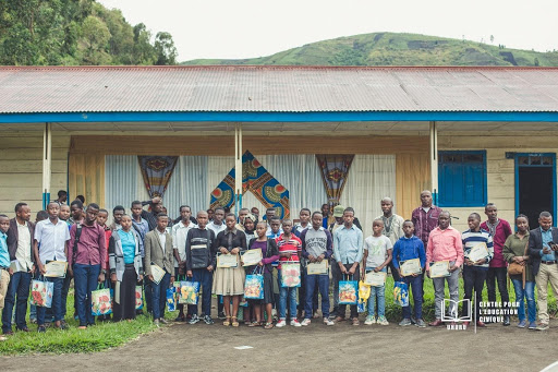 A group of young people holding certificates